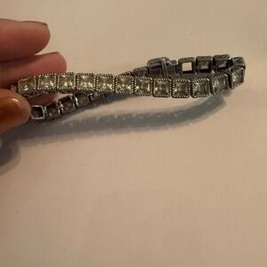 Judith Ripka Sterling Silver Emerald Cut Diamonique Tennis Bracelet 7" read